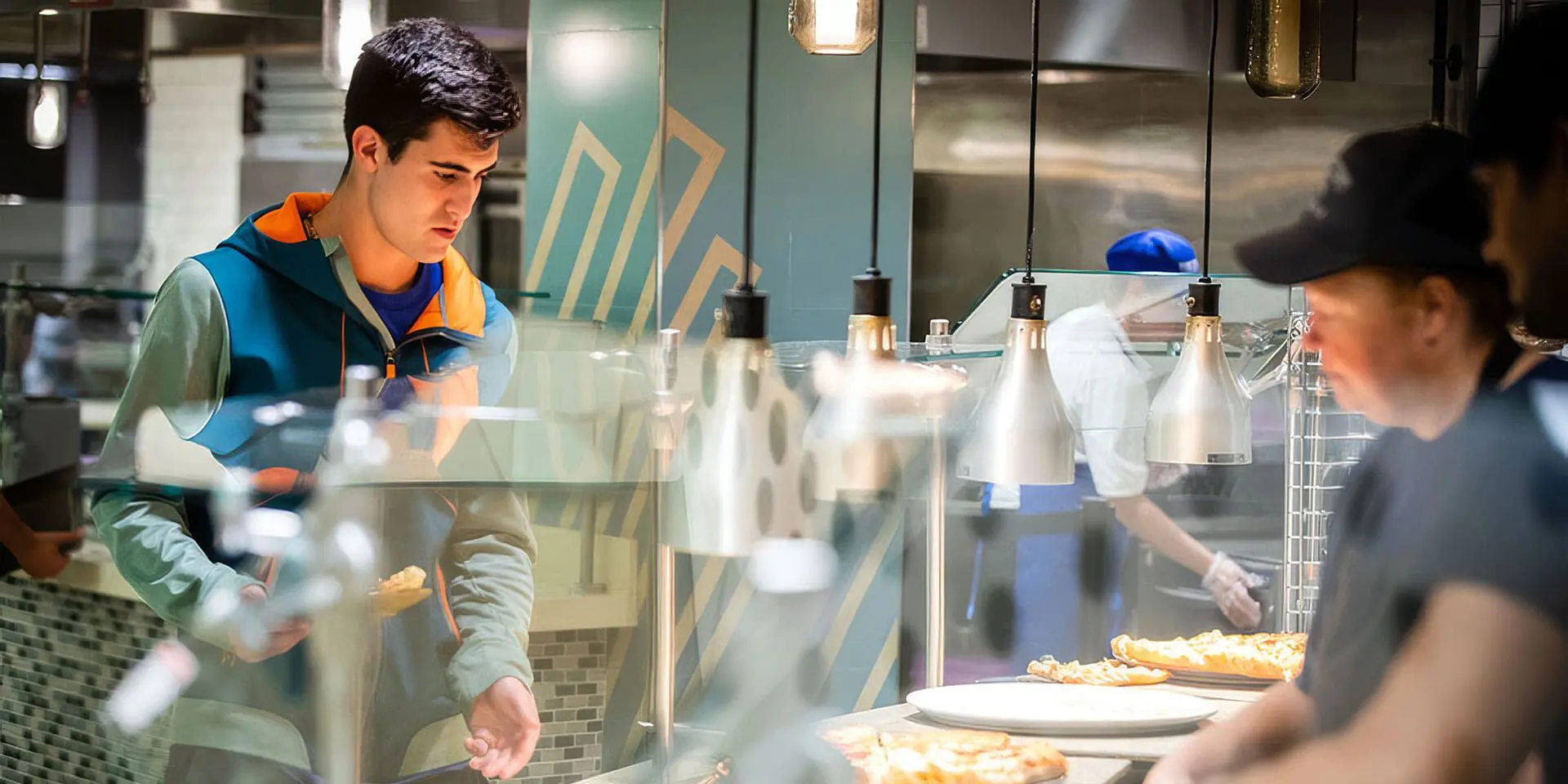 Student looking at food on serving line